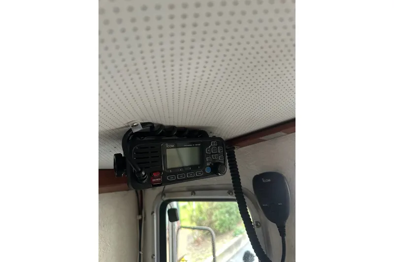 Slide: The Image of Marine radio installed in a 1999 Skagit Orca 24 boat cabin. - 25