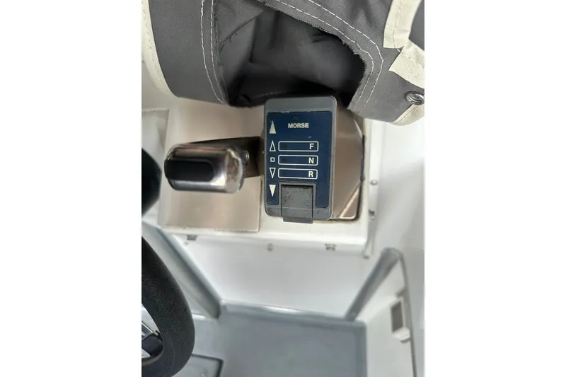 Slide: The Image of Control panel of a 1999 Skagit Orca 24 boat with Morse throttle lever. - 12