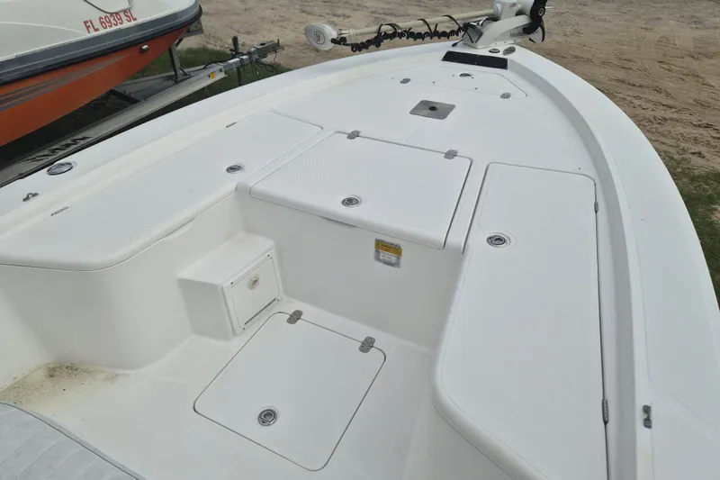 Slide: The Image of Kenner Vision 2103 boat deck, 2006 model, featuring storage compartments and trolling motor. - 23