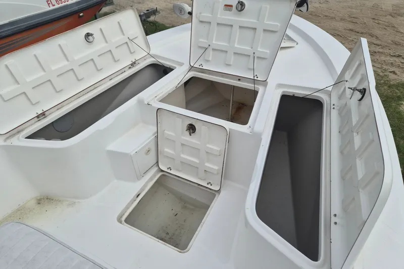 Slide: The Image of Open storage compartments on a 2006 Kenner Vision 2103 boat deck. - 24