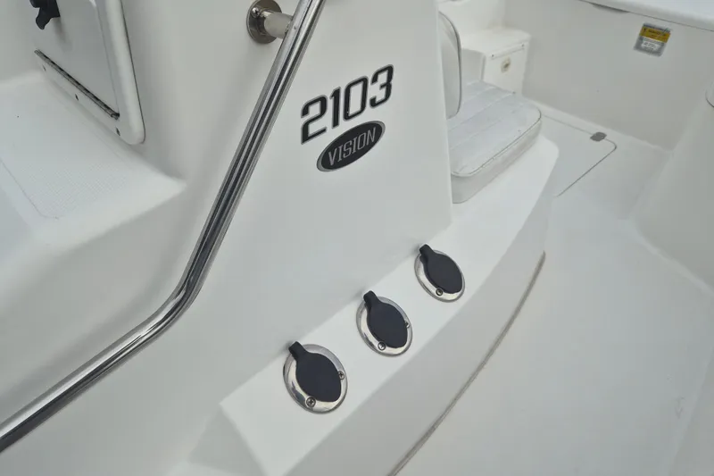 Slide: The Image of Kenner Vision 2103 boat interior, 2006 model, featuring sleek design and seating area. - 19
