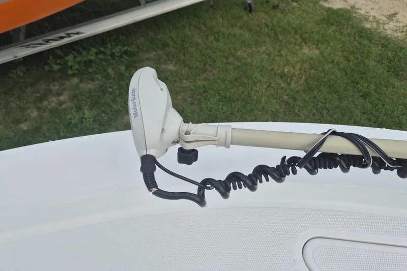 Slide: The Image of Kenner Vision 2103 boat with MotorGuide trolling motor, 2006 model, on grassy background. - 31