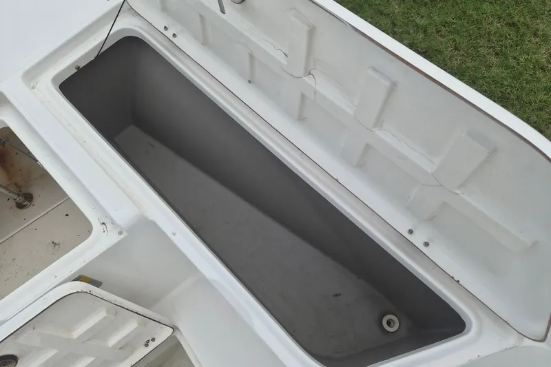 Slide: The Image of Open storage compartment on a 2006 Kenner Vision 2103 boat. - 26
