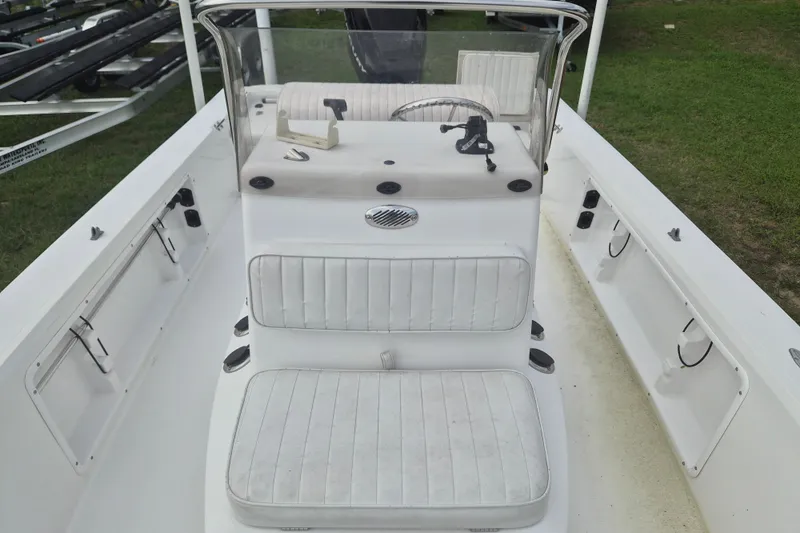 Slide: The Image of Kenner Vision 2103 boat interior, 2006 model, featuring white seating and steering console. - 21