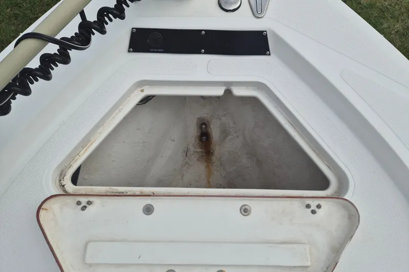 Slide: The Image of Open storage compartment on a 2006 Kenner Vision 2103 boat, showing interior details. - 28