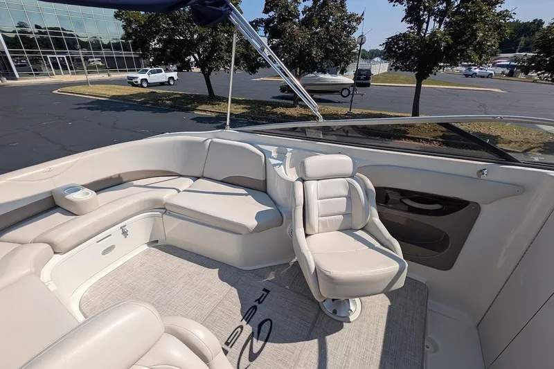 Slide: The Image of Interior of a 2002 Regal 2450 LSC boat with plush seating and modern design. - 25