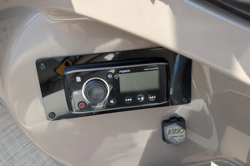 Slide: The Image of Audio control panel on 2002 Regal 2450 LSC boat dashboard. - 36