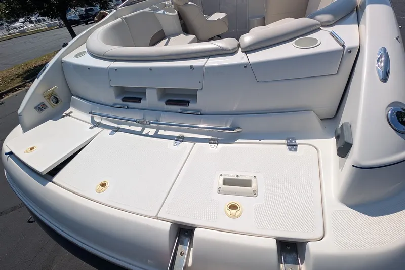 Slide: The Image of 2002 Regal 2450 LSC boat interior with seating and storage compartments. - 15