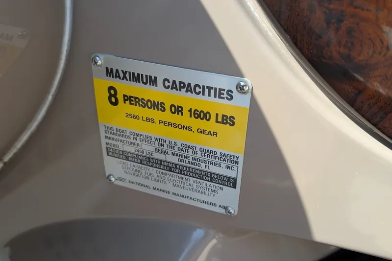 Slide: The Image of Capacity label on 2002 Regal 2450 LSC boat, max 8 persons or 1600 lbs. - 46