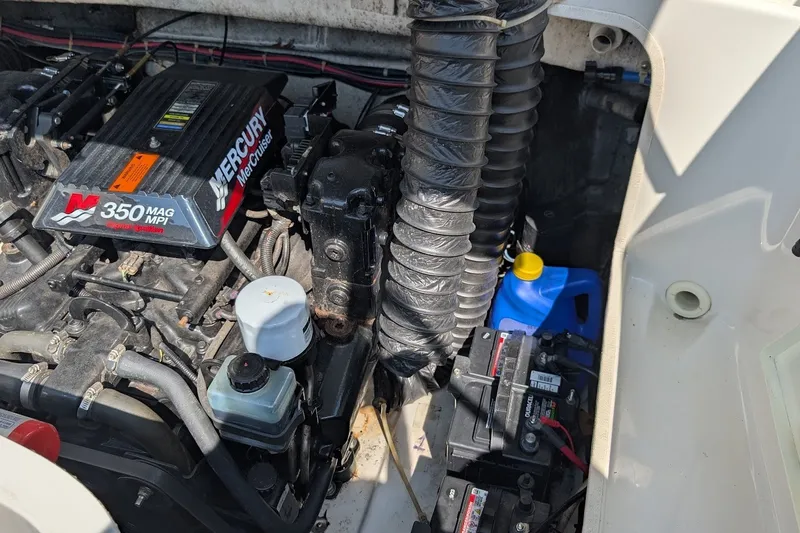 Slide: The Image of Engine compartment of a 2002 Regal 2450 LSC boat with Mercury 350 MAG MPI engine. - 42