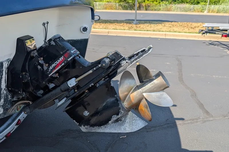 Slide: The Image of 2002 Regal 2450 LSC boat with Mercury outboard motor and stainless steel propeller. - 11