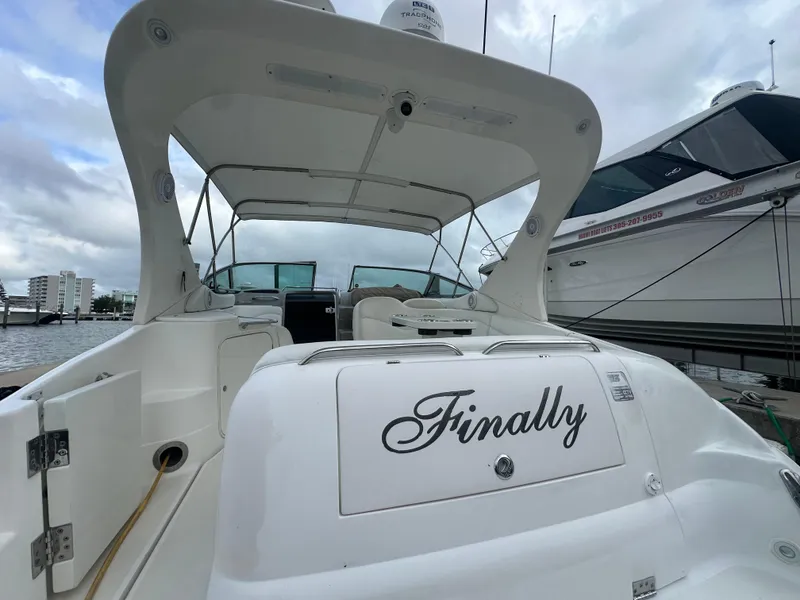 Slide: The Image of 2001 Wellcraft 3300 Martinique boat named "Finally" docked at marina. - 28