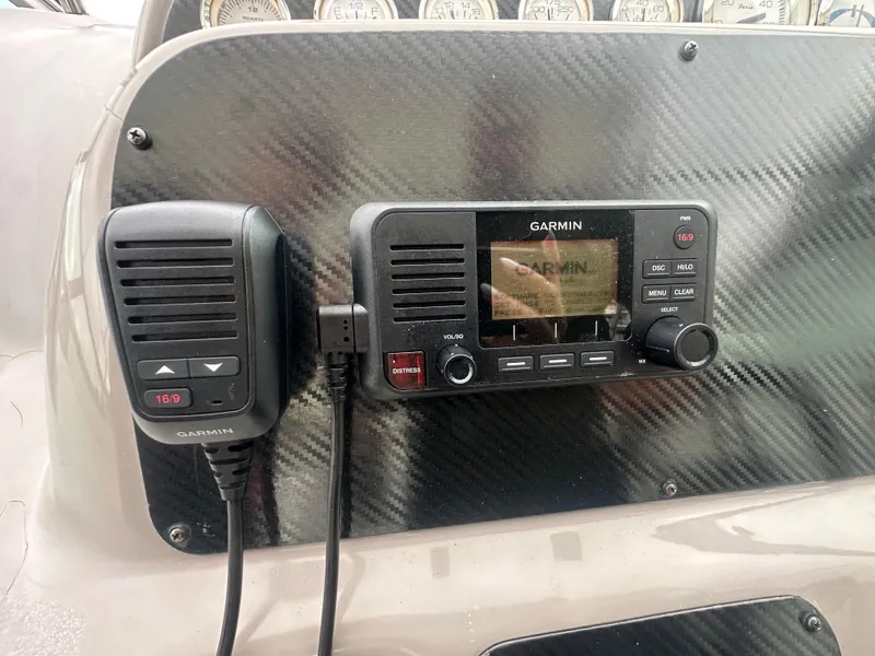 Slide: The Image of Garmin marine radio on 2001 Wellcraft 3300 Martinique dashboard. - 14