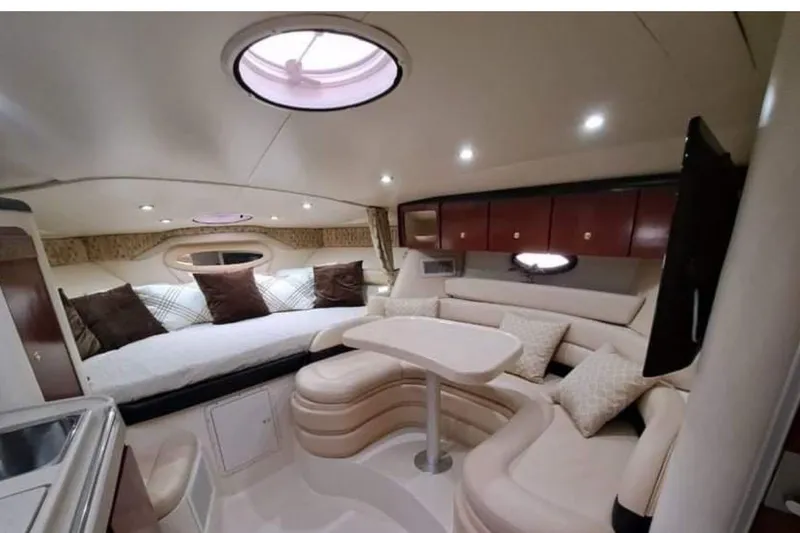 Slide: The Image of 2001 Wellcraft 3300 Martinique interior with cozy seating and elegant design. - 20