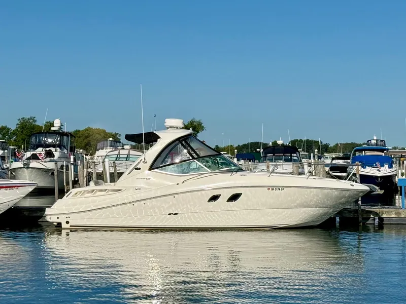 The Image of 2009 Sea Ray Sundancer 310 docked at a marina. - 0