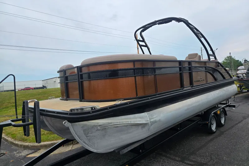 Slide: The Image of 2017 Bennington G 23 GSBA pontoon boat on trailer, parked outdoors. - 5