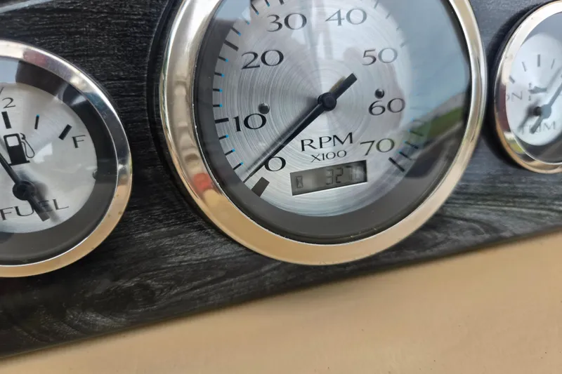 Slide: The Image of Close-up of 2017 Bennington G 23 GSBA dashboard gauges, showing RPM and fuel levels. - 16