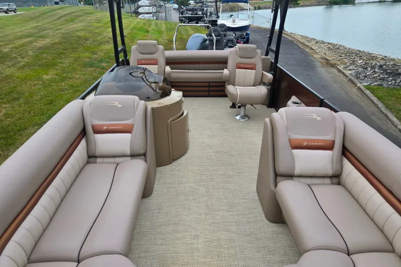 Slide: The Image of 2017 Bennington G 23 GSBA pontoon boat with luxurious beige seating and spacious deck. - 11