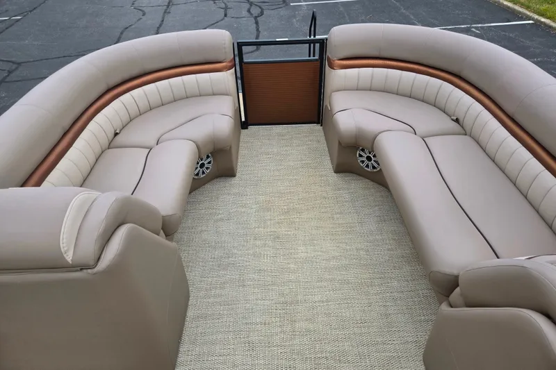 Slide: The Image of 2017 Bennington G 23 GSBA boat interior with beige seating and carpet flooring. - 24