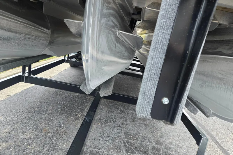 Slide: The Image of Underneath view of a 2017 Bennington G 23 GSBA pontoon boat on a trailer. - 7