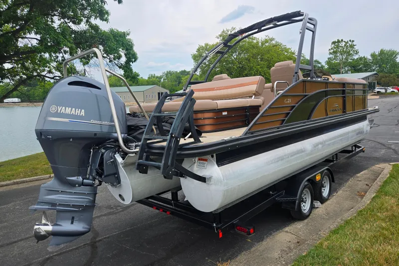 Slide: The Image of 2017 Bennington G 23 GSBA pontoon boat with Yamaha engine on trailer. - 1