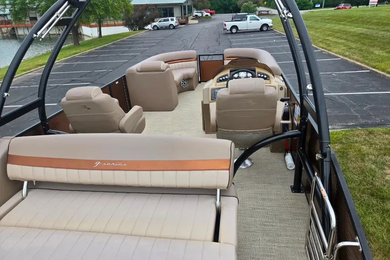 Slide: The Image of 2017 Bennington G 23 GSBA pontoon boat interior with plush seating and steering console. - 20
