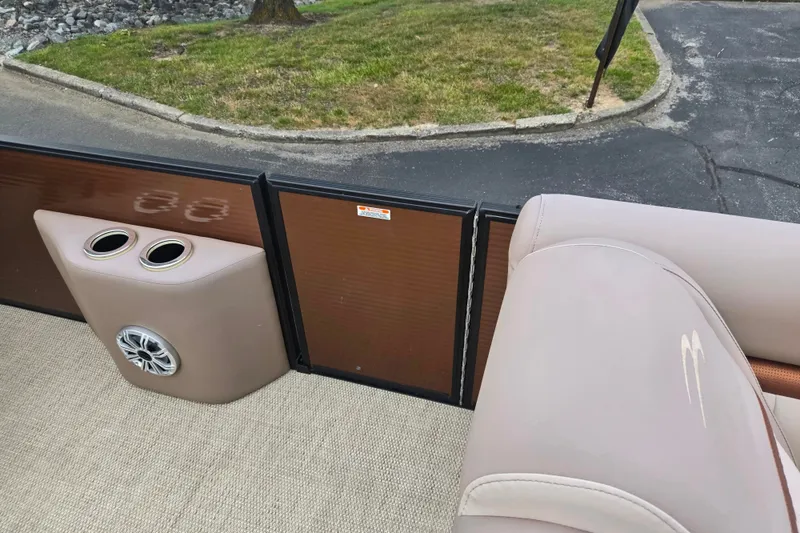 Slide: The Image of Interior of a 2017 Bennington G 23 GSBA boat with cup holders and speaker. - 12
