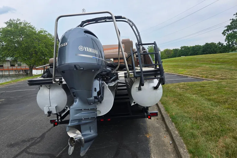 Slide: The Image of 2017 Bennington G 23 GSBA pontoon boat with Yamaha 150 engine on trailer. - 2
