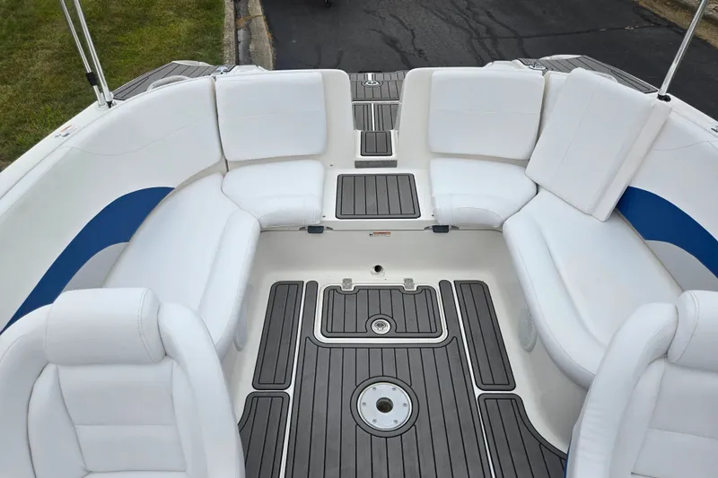 Slide: The Image of 2005 Yamaha Boats SX230 interior with white seating and gray flooring. - 21