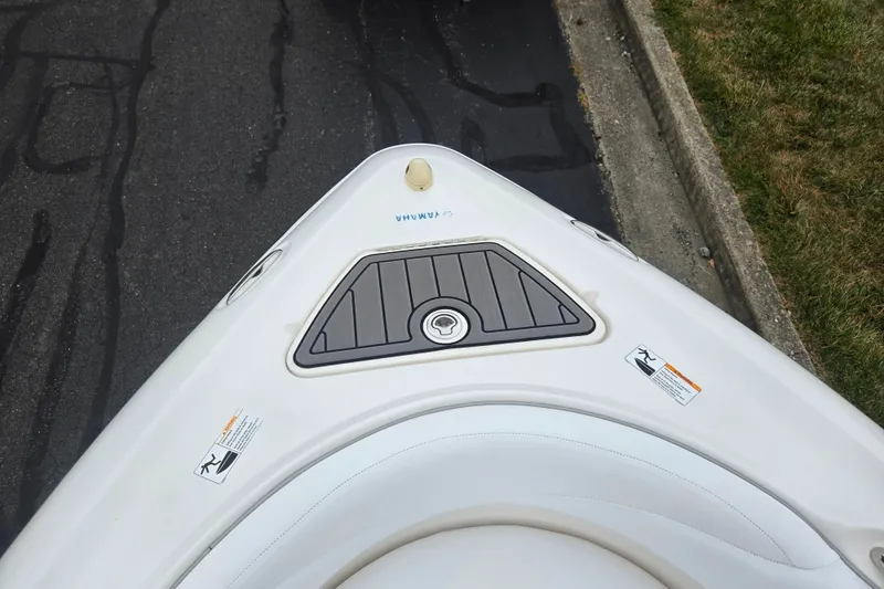 Slide: The Image of Bow of a 2005 Yamaha Boats SX230, featuring sleek design and safety labels. - 17