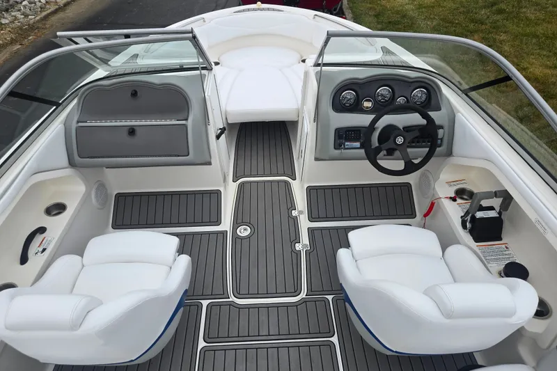 Slide: The Image of Interior of a 2005 Yamaha Boats SX230, featuring sleek seating and modern dashboard controls. - 10
