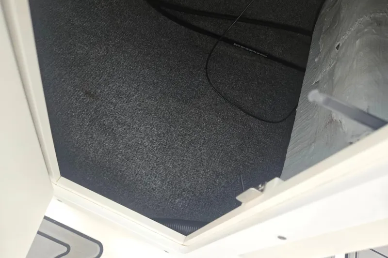 Slide: The Image of Interior storage compartment of a 2005 Yamaha Boats SX230. - 14