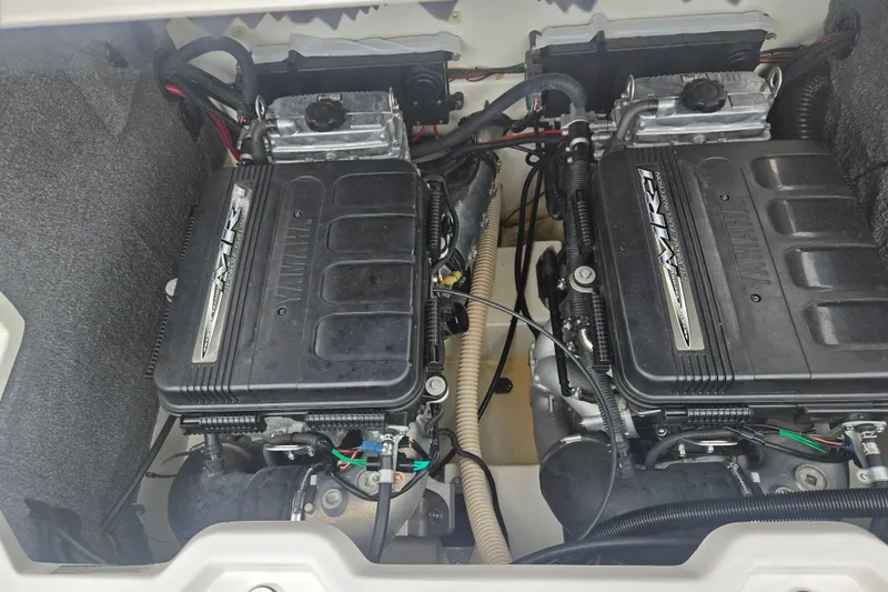 Slide: The Image of Twin engines of a 2005 Yamaha Boats SX230, showcasing detailed components. - 22