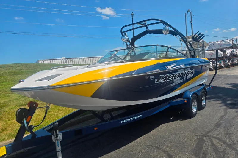 Slide: The Image of 2012 Moomba Mojo 2.5 boat on trailer, featuring sleek design and vibrant colors. - 5