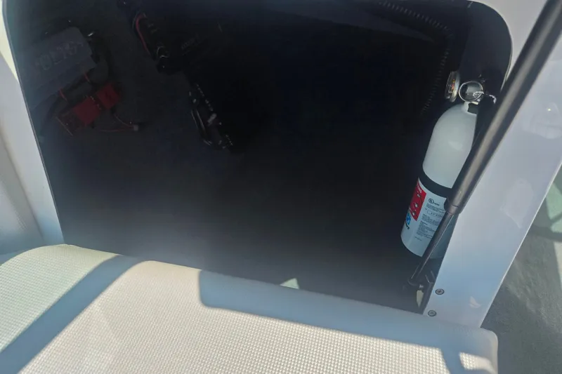 Slide: The Image of 2012 Moomba Mojo 2.5 interior storage with fire extinguisher and wiring. - 13