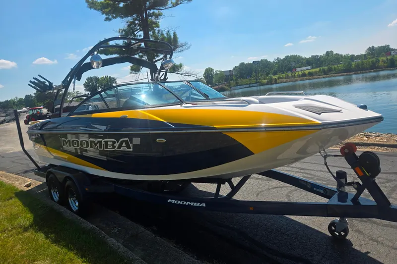 Slide: The Image of 2012 Moomba Mojo 2.5 boat on trailer by a lake, sunny day. - 8