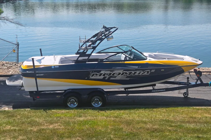 The Image of 2012 Moomba Mojo 2.5 boat on trailer by a lake. - 0