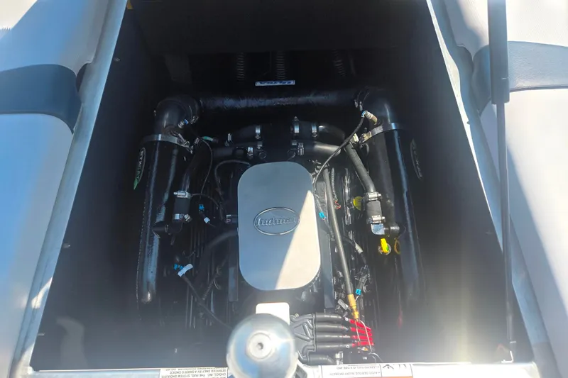 Slide: The Image of Engine compartment of a 2012 Moomba Mojo 2.5 boat, showcasing Indmar engine components. - 23