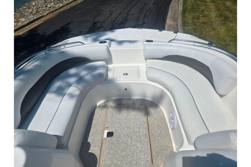 Slide: The Image of 2013 Hurricane SunDeck Sport 188 OB boat interior with white seating and carpeted floor. - 20