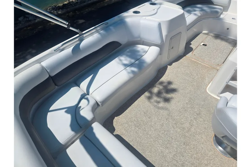 Slide: The Image of 2013 Hurricane SunDeck Sport 188 OB boat interior with spacious seating and carpeted floor. - 16