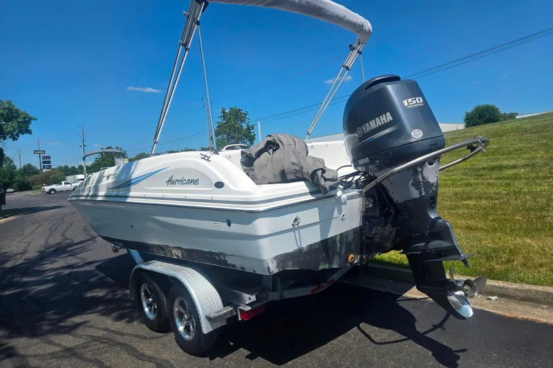 Slide: The Image of 2013 Hurricane SunDeck Sport 188 OB boat with Yamaha 150 engine on trailer. - 3