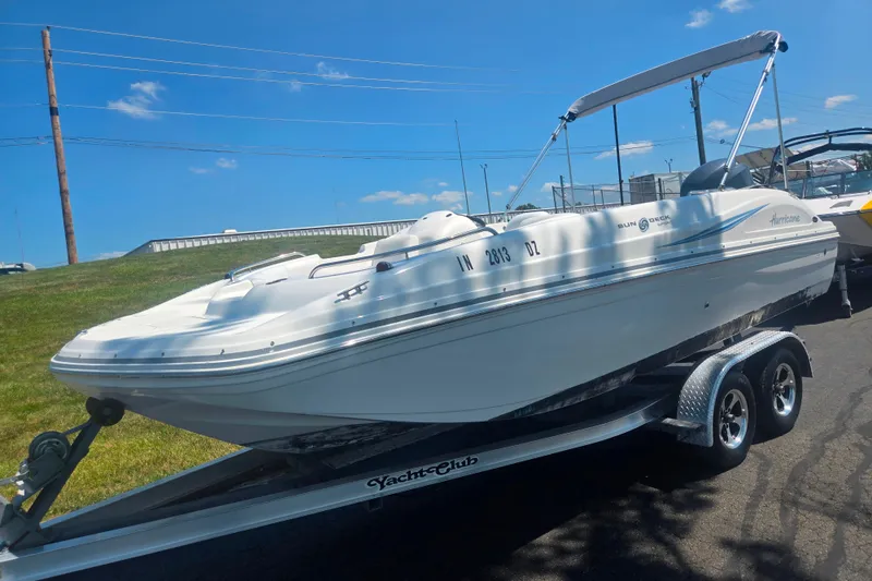 Slide: The Image of 2013 Hurricane SunDeck Sport 188 OB boat on trailer, sunny day, clear sky. - 5