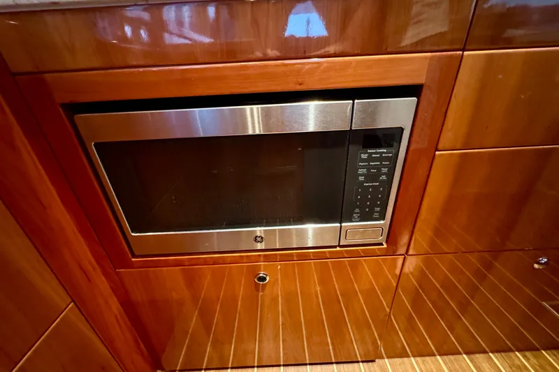 Slide: The Image of Built-in microwave in 2009 Riviera 45 Open Flybridge yacht kitchen. - 35