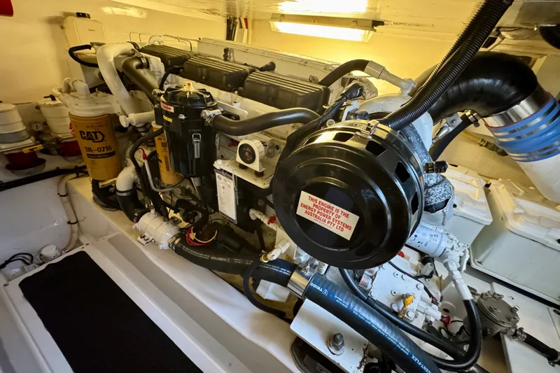 Slide: The Image of Engine room of a 2009 Riviera 45 Open Flybridge yacht, showcasing detailed machinery. - 58