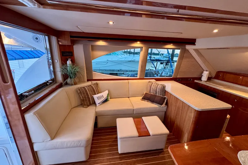 Slide: The Image of Luxurious interior of 2009 Riviera 45 Open Flybridge yacht with elegant seating and wooden accents. - 27