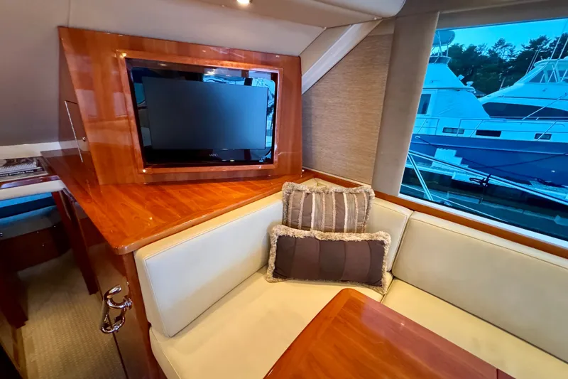 Slide: The Image of Luxurious interior of 2009 Riviera 45 Open Flybridge yacht with TV and plush seating. - 31