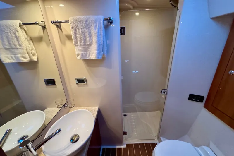 Slide: The Image of Luxurious bathroom in 2009 Riviera 45 Open Flybridge yacht with modern fixtures. - 54