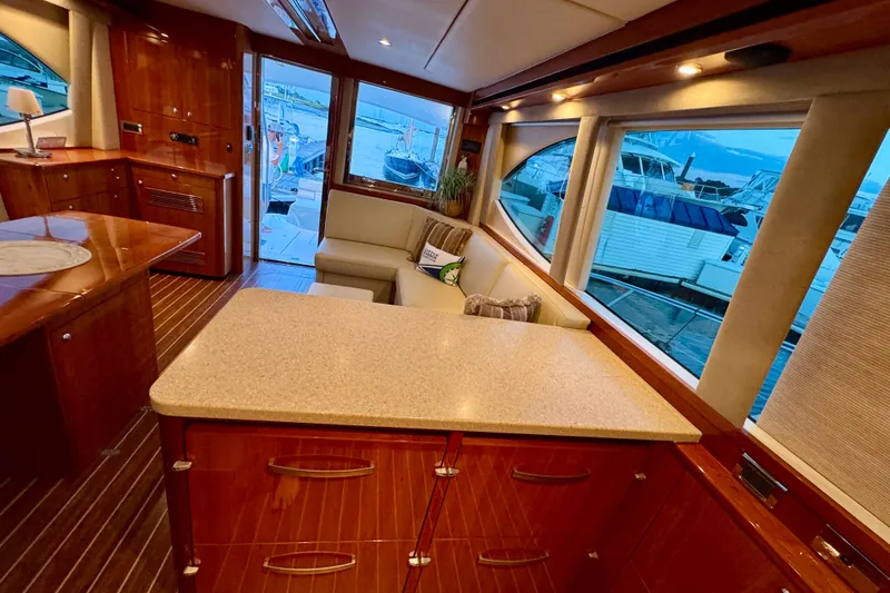 Slide: The Image of Luxurious interior of 2009 Riviera 45 Open Flybridge yacht with elegant wood finishes. - 37