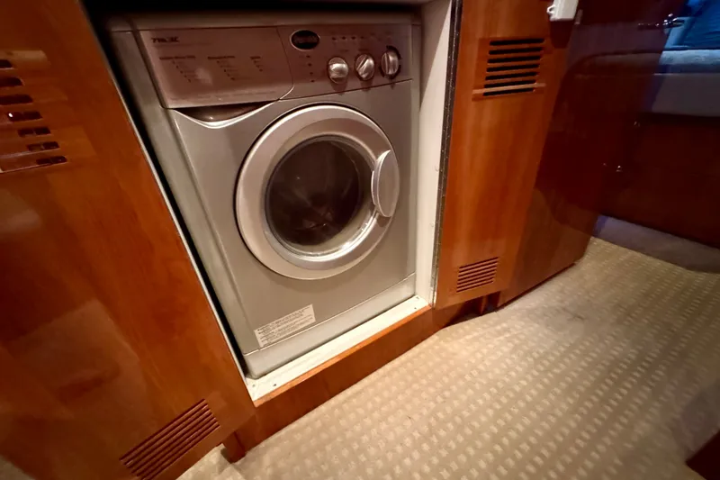 Slide: The Image of Washing machine in 2009 Riviera 45 Open Flybridge yacht interior. - 48
