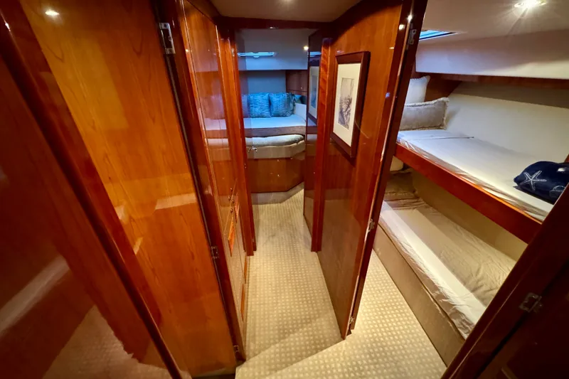 Slide: The Image of Luxurious interior of 2009 Riviera 45 Open Flybridge yacht with cozy cabins and elegant wood finishes. - 42